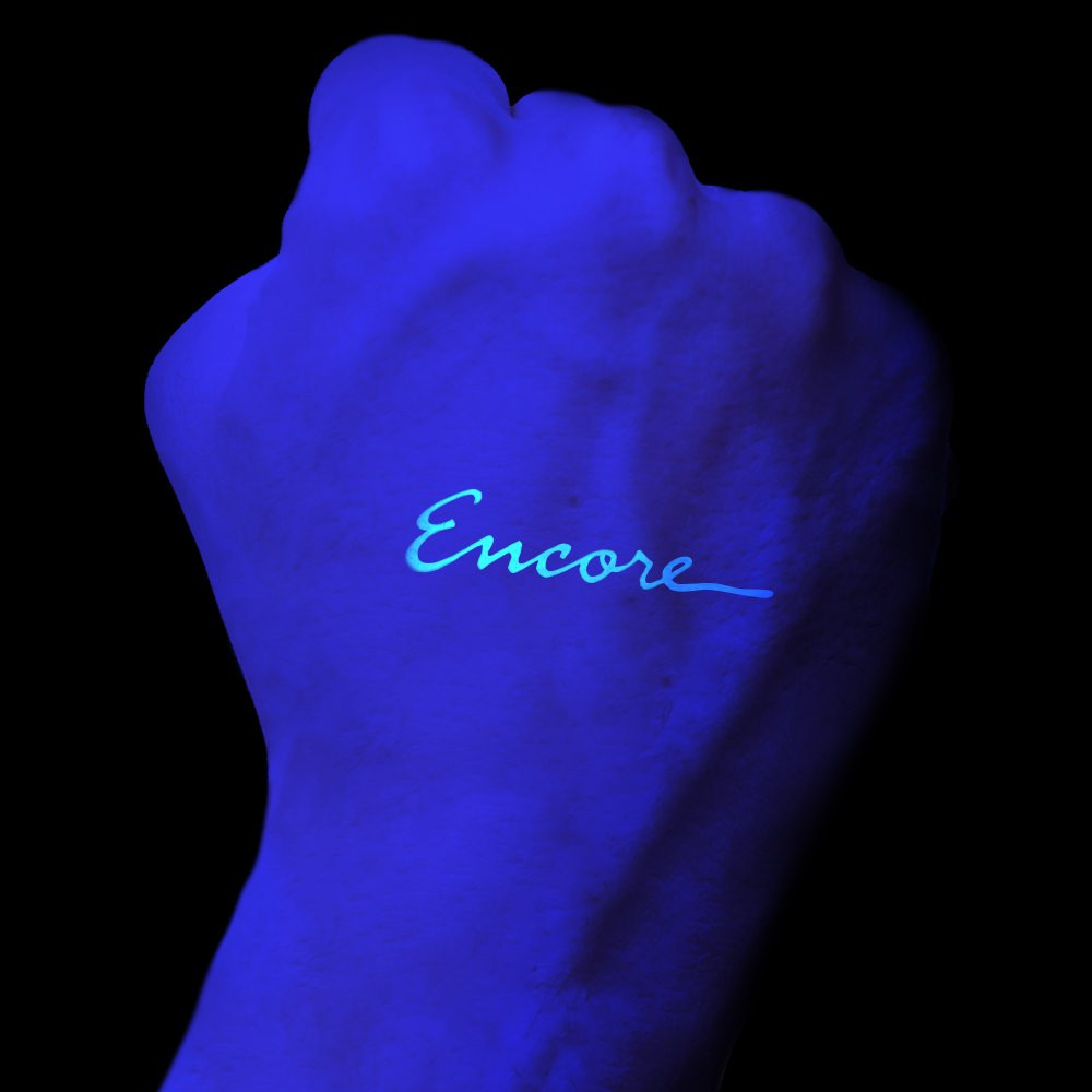 Ultra-Violet stamp shown on hand from Self Inking Hand Stamp w/ Logo - 5/8" Round