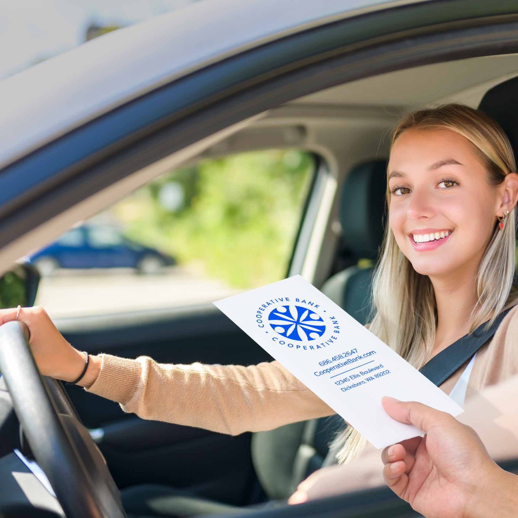 Drive up money envelope shown with bank teller and customer in us 
