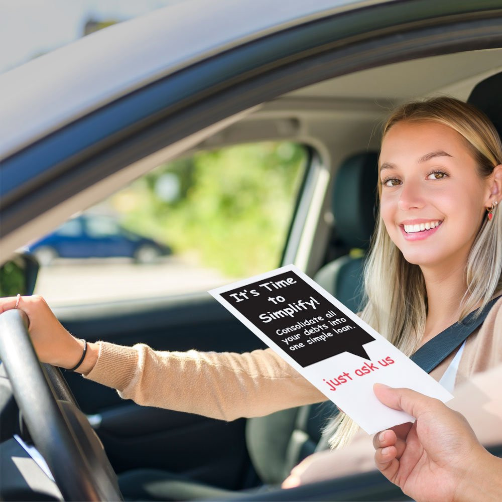Drive up bank envelope in use with bank teller and banking customer 