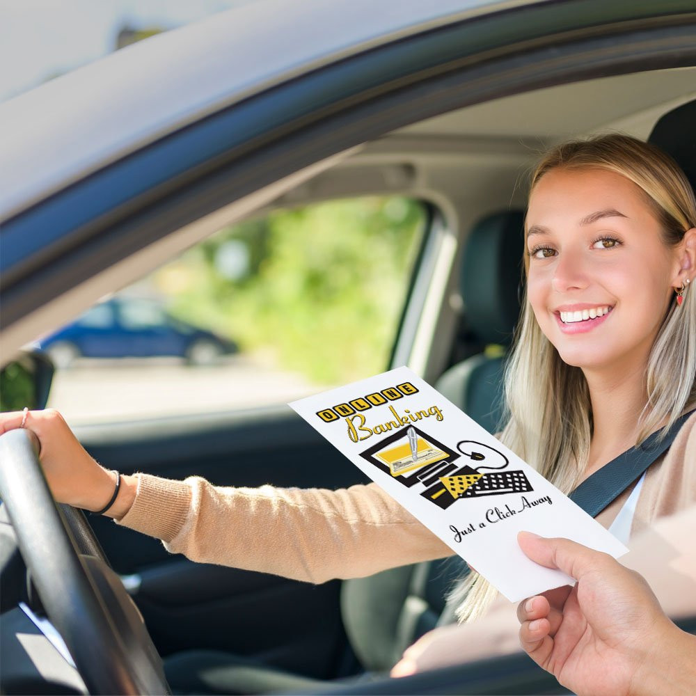Drive up envelope shown in use with bank teller and banking customer