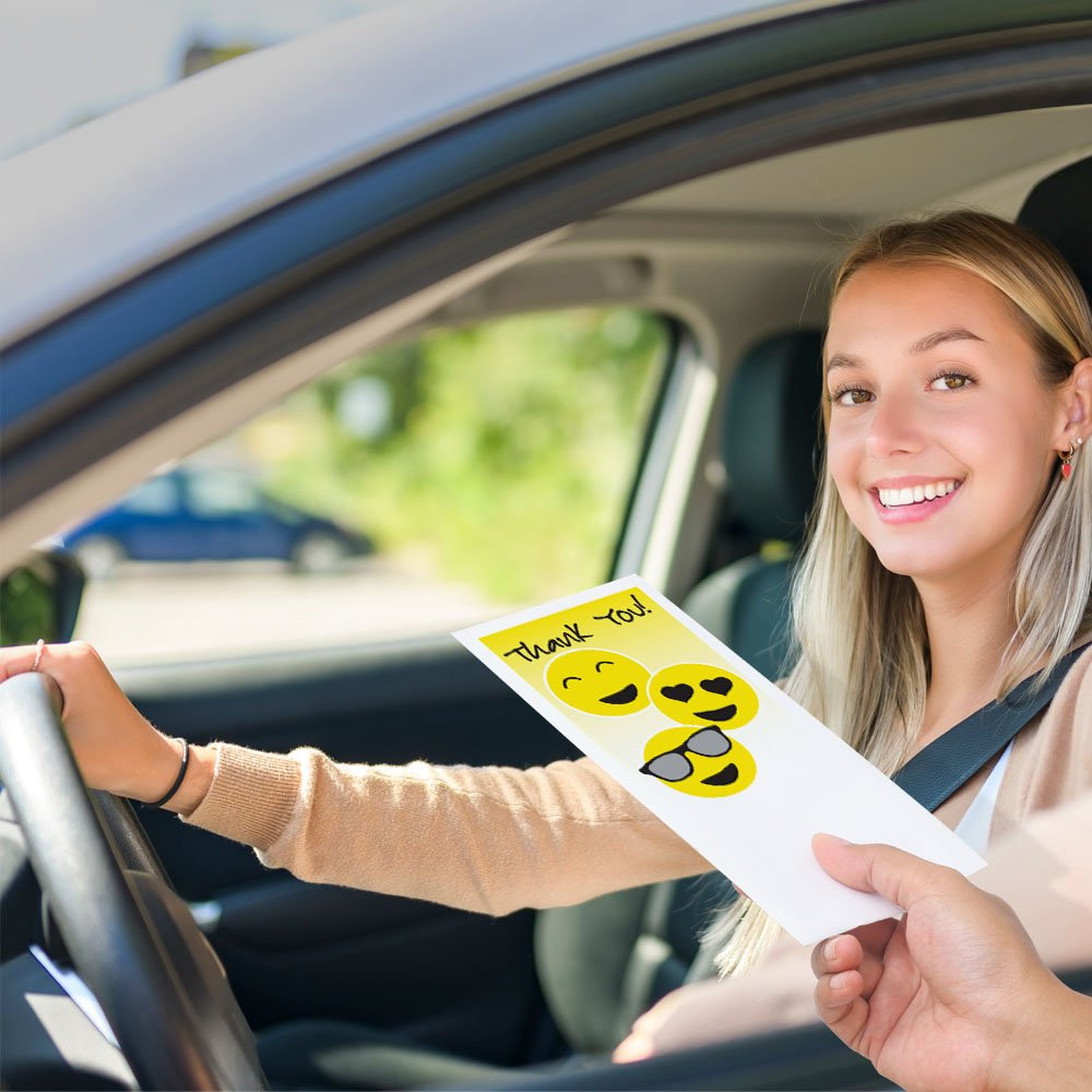 Drive up envelope shown in use with bank teller and banking customer