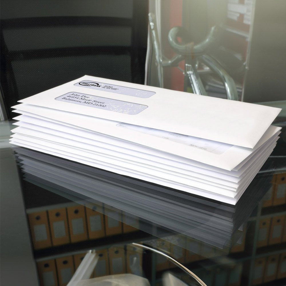 lifestyle image of Self-Sealing Standard No. 9 Double Window Check Envelopes - Versa Check Software shown stack on top of each other 