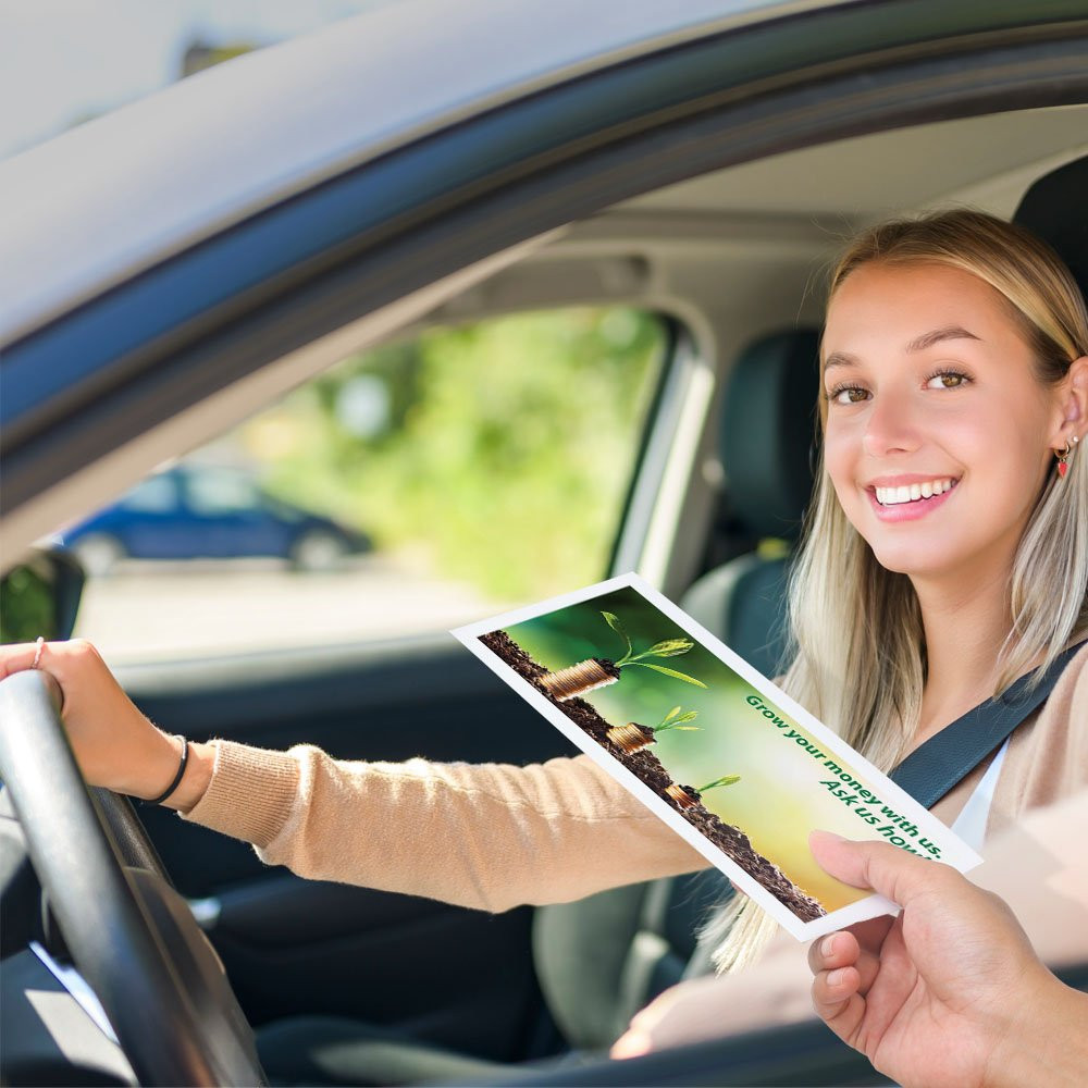 Drive up envelope in use with bank teller and banking customer