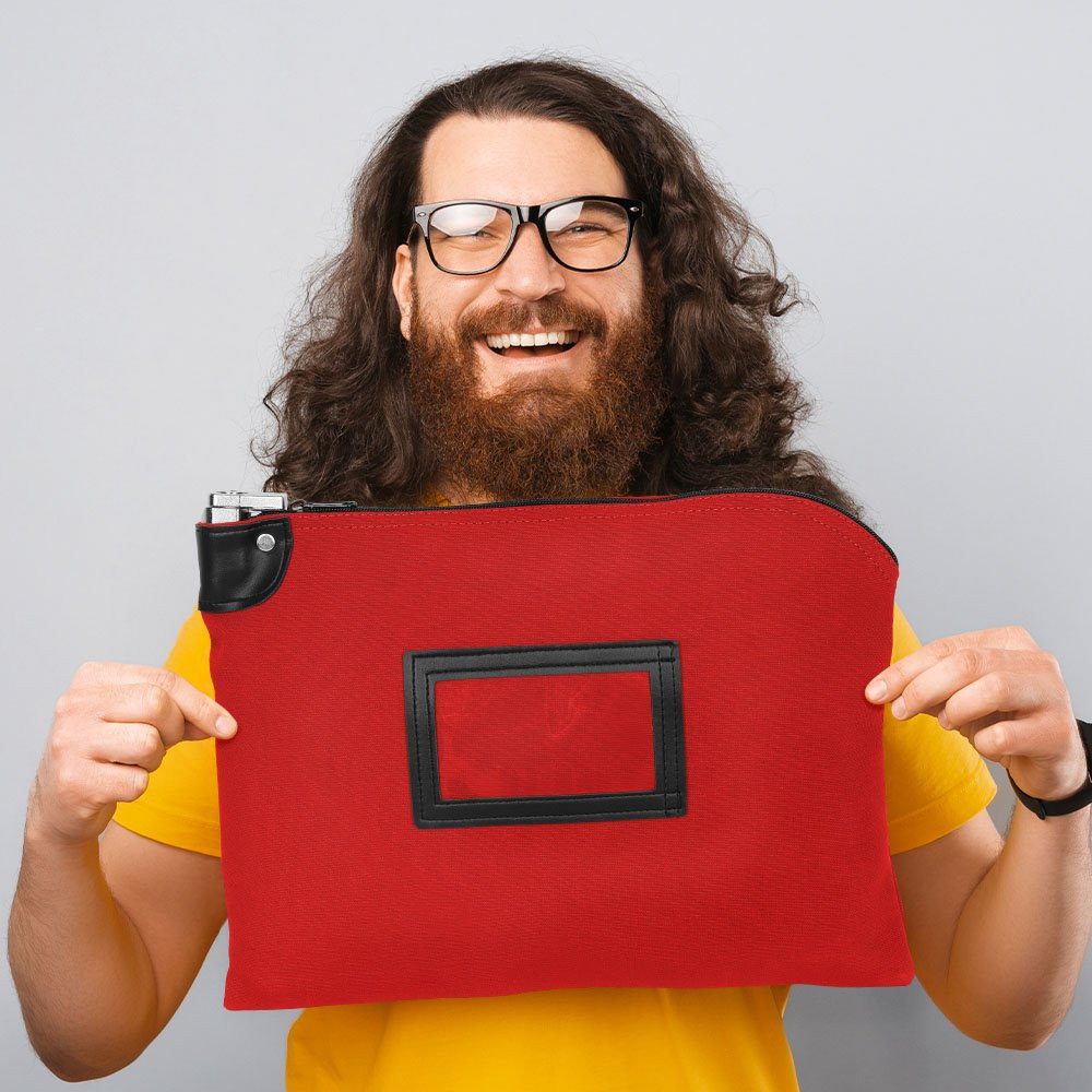 Customer holding a 15W x 11H, 14 oz Red Locking Deposit Bag made of durable cotton canvas.