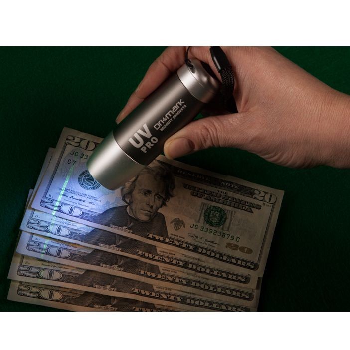 DriMark UV Counterfeit Detector Light - testing pen on cash