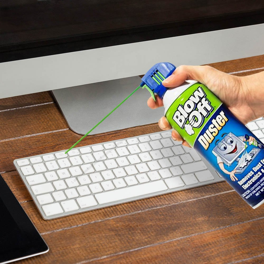 Canned Air 10 oz cans in use on computer keyboard