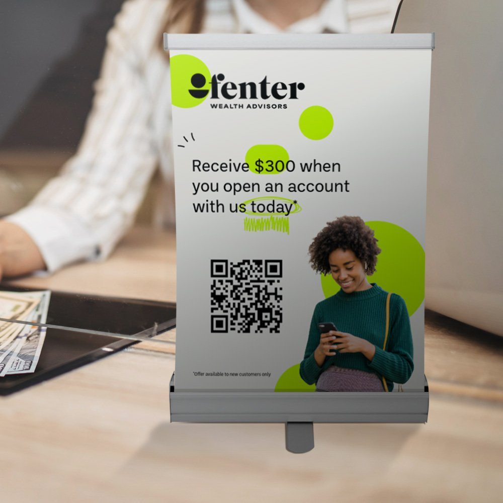 Tabletop economy retractor banner kit shown in use at a bank lobby