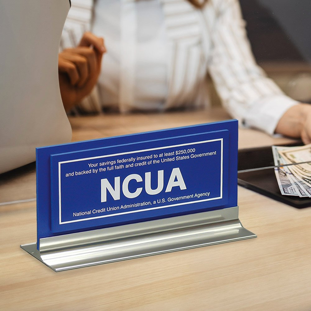 NCUA $250,000 counter sign - blue and silver with white text - In use 