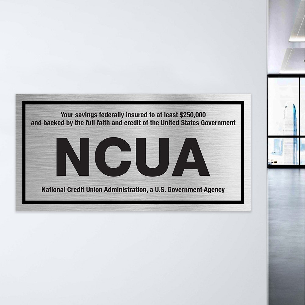 Wall plate - NCUA - Silver with black text - In use 