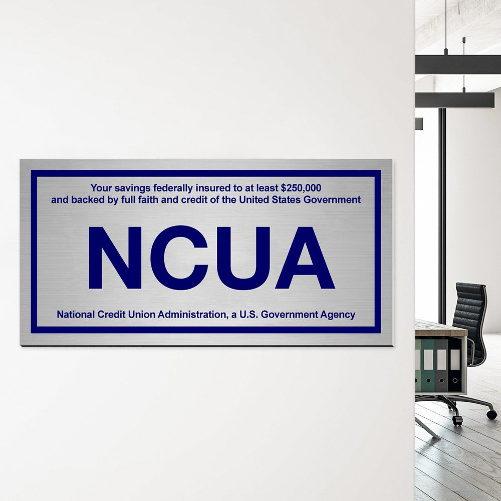 Wall plate NCUA - Silver with blue text - In use 