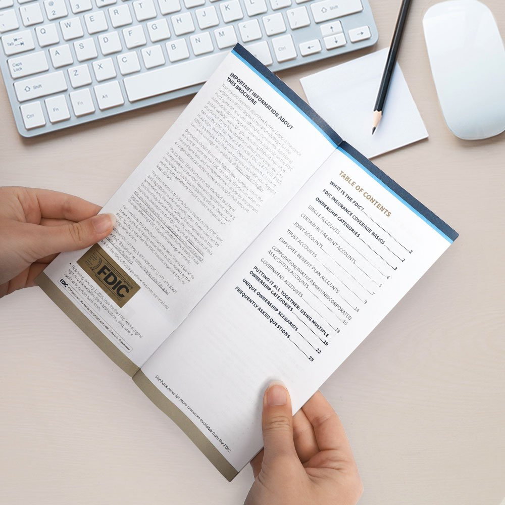 Person reading FDIC Booklet