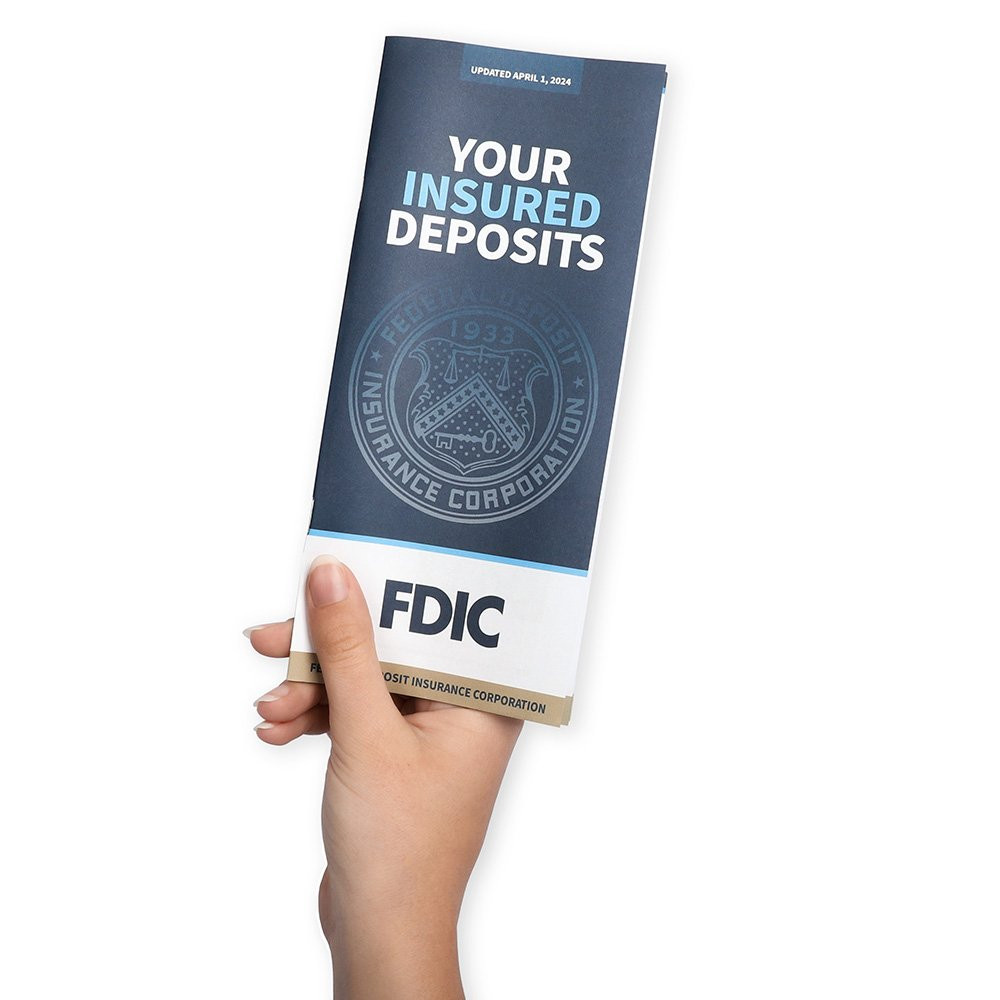 Person holding FDIC Booklet - Your Insured Deposits - 30 Pages 