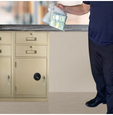 Institute employee shown with deposit ready for Fenco Silverline Pedestal shown with key locking L-handle and mechanical combination