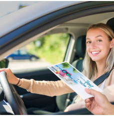 Drive thru money envelopes shown in use with bank teller and bank customer