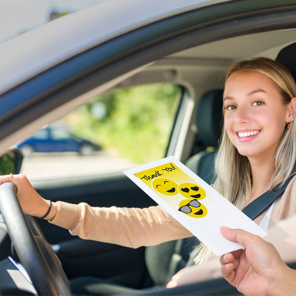 Drive up bank envelope in use with bank teller and banking customer 