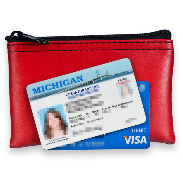 lifestyle image to show size on red vinyl zipper wallet with ID and Debit card to show actually size 
