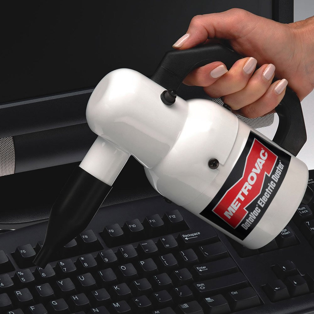 Datavac Electric Duster with nozzle attachments in use on keyboard