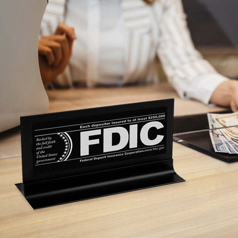 FDIC $250000 Framed Counter Sign - Black w/ White Text Shown Displayed On Counter Top